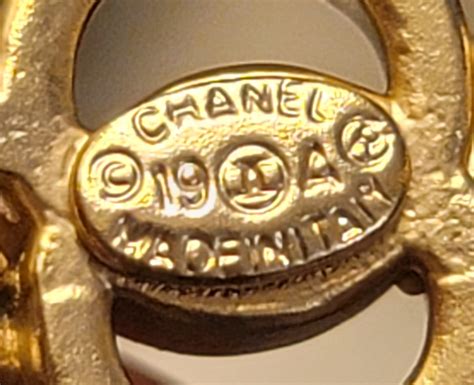 how to tell fake to real chanel jewelry|authentic chanel jewelry stamp.